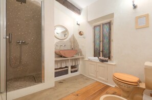 Shower, hair dryer, slippers, towels