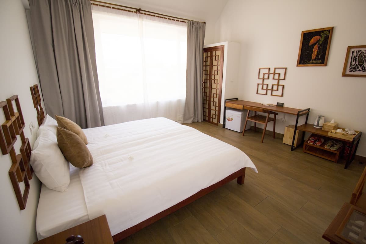 Superior Room | Minibar, in-room safe, individually decorated, desk
