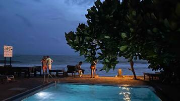 Outdoor pool, open 8:30 AM to 8:30 PM, free cabanas, pool umbrellas