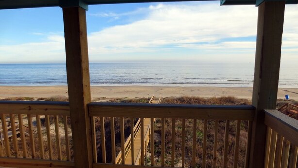 A wooden deck with a view of the beach and ocean. - "As Good As It Gets" Beautiful Beach Front House! (Surfside Beach)