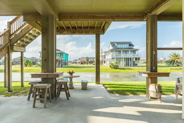 Under house seating overlooking water canal
