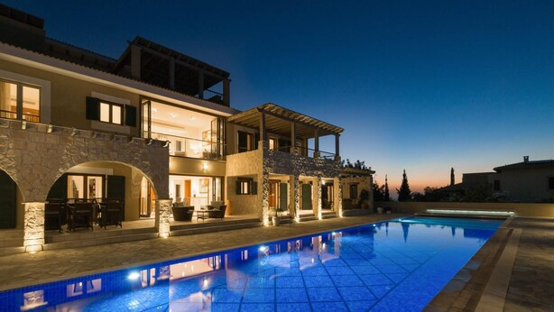 A two-story house with a swimming pool, stone arches, and outdoor seating. - Villa 141 Rio - Five Bedroom Villa, Sleeps 10 (Kouklia)