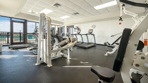 A gym with treadmills, weight machines, and a bench. - Awesome Views and 10 Foot Ceilings in this Penthouse Unit on the 15th floor! (Orange Beach)