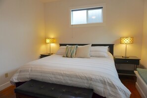 Restful retreat with a large bed, bedside tables, and a window.