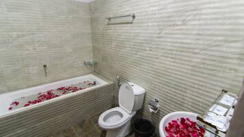Family Room, Multiple Beds | Bathroom | Combined shower/tub, slippers, towels