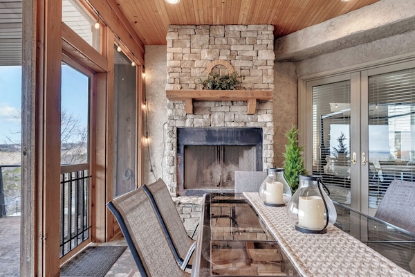 Beautiful screened porch with working fireplace.