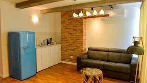Executive-Suite, Stadtblick | Wohnzimmer | Flachbildfernseher