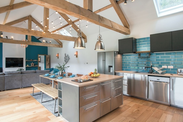 Amazing stainless steel contemporary kitchen | The Pendre Longbarn, Pont-Rhyd-y-Groes, near Ystrad Meurig