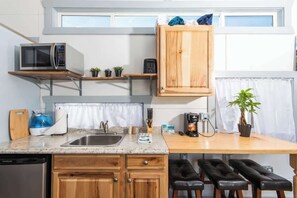 Fridge, microwave, stovetop, coffee/tea maker