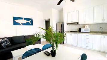 Fridge, coffee/tea maker, cookware/dishes/utensils, paper towels