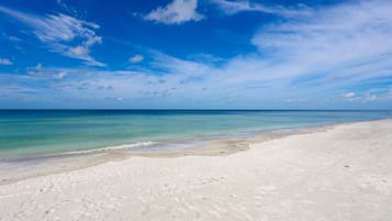 On the beach, sun loungers, beach towels