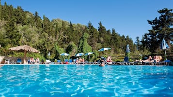 Seasonal outdoor pool, open 9:00 AM to 8:00 PM, pool umbrellas