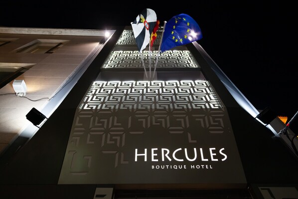 The Hercules Boutique Hotel sign with a geometric pattern and flags. - Hercules Boutique Hotel (Ceuta)