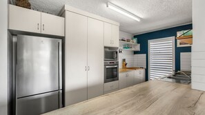 Coffee/tea maker, fridge, microwave, oven - Moondara Unit 2, 21 Bulcock Beach Esplanade, Bulcock Beach (Bulcock Beach)