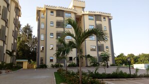 A multi-story building with balconies and a central courtyard. - Sunset Paradise Baringo 12 (Mombasa)