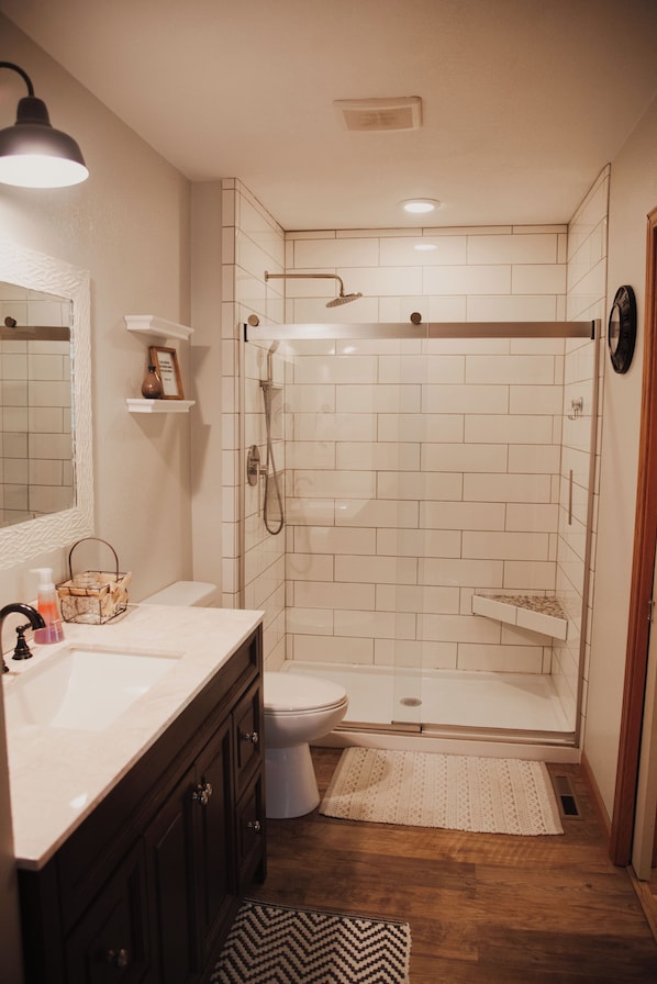 Combined shower/tub, hair dryer, towels, soap
