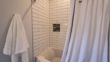 Combined shower/tub, hair dryer, towels, soap