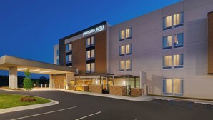 A modern hotel with a flat facade, large windows, and a covered entrance area. - SpringHill Suites by Marriott Tifton (Tifton)