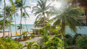 A tropical resort with a pool, palm trees, and a beach view. - Princess Paradise Koh Phangan (Ko Pha-ngan)