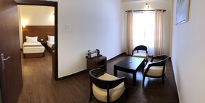 Standard Triple Room, Multiple Beds | Living area | LED TV - Legphel Hotel (Phuntsholing)