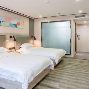 A modern hotel room with two beds, a large sliding door, and a wooden floor. - Vyluk Hotel Zhuhai Gongbei (Zhuhai)