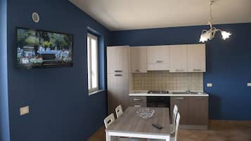 Apartment, 1 Bedroom | Living area | Flat-screen TV