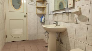 Shower, free toiletries, hair dryer, slippers