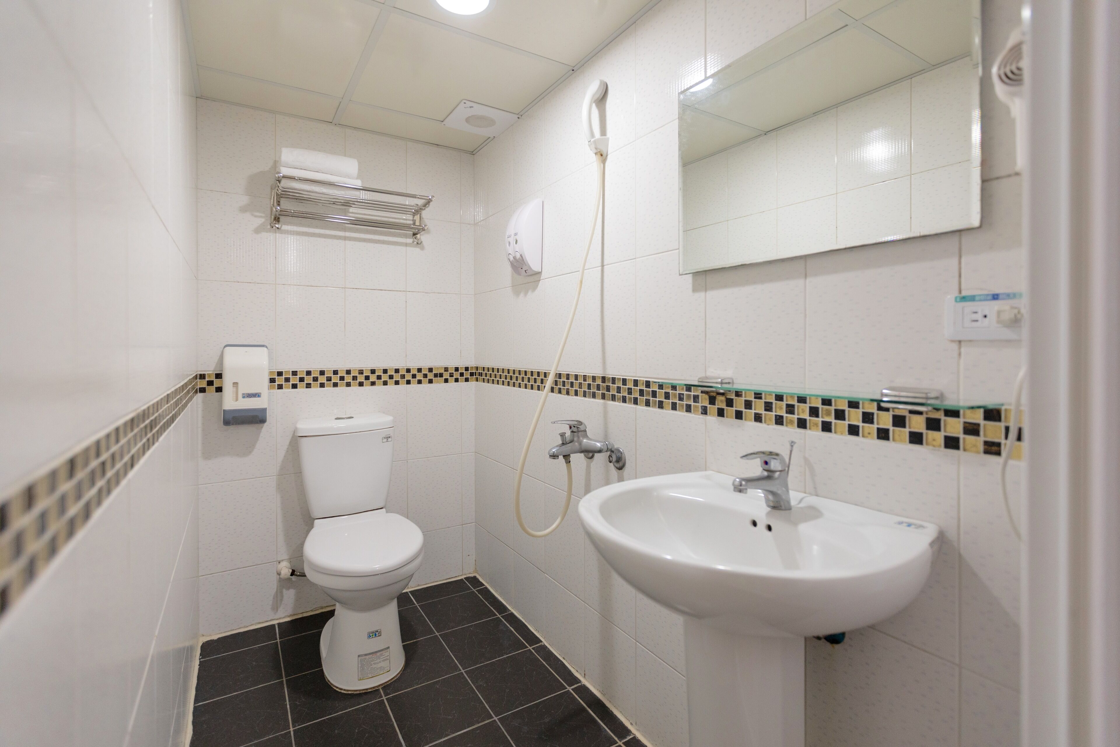 Economy Double Room, No Windows | Bathroom | Shower, hair dryer, slippers, towels