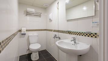 Economy Double Room, No Windows | Bathroom | Shower, hair dryer, slippers, towels