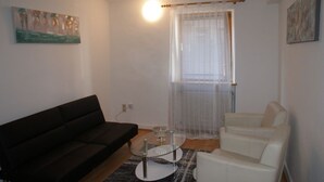 Apartment, 2 Bedrooms (#2) | Living area | Flat-screen TV - Saarlogis (Saarbrücken)