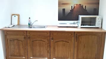 Apartment (#1) | Private kitchenette | Full-sized fridge, oven, stovetop, cookware/dishes/utensils