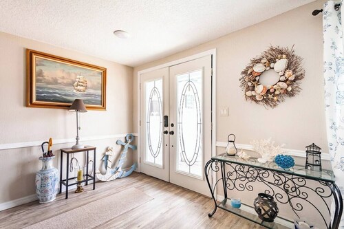 Private bedroom and private bath at separate end of home with water views.