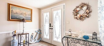 Private bedroom and private bath at separate end of home with water views.