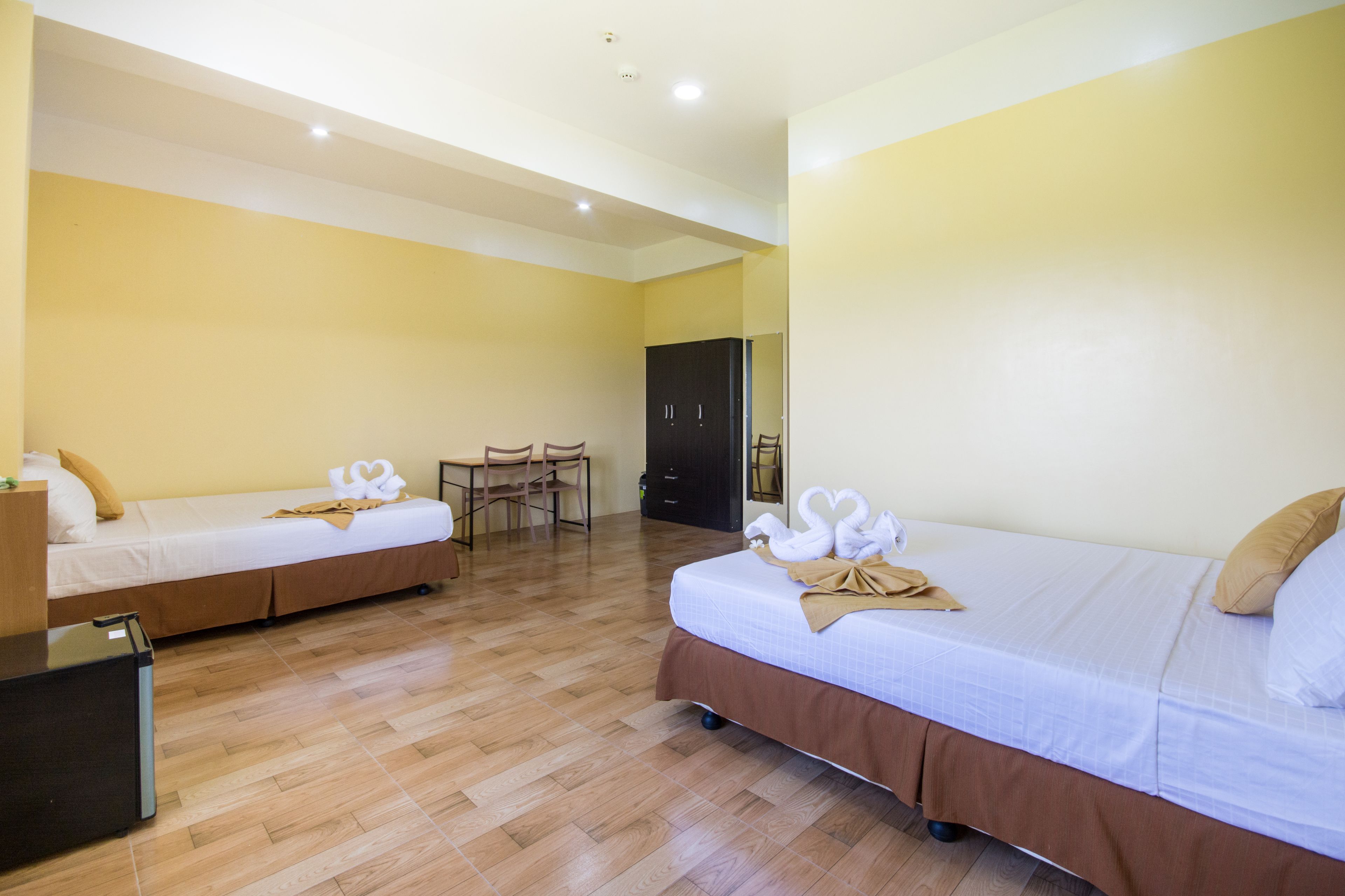 family room, 2 queen beds | 1 bedroom, individually furnished, desk, free wifi