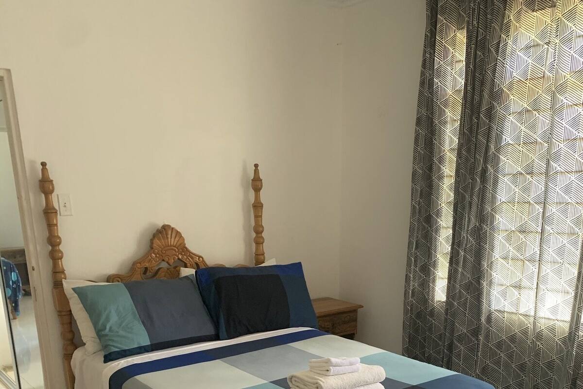 Premium bedding, laptop workspace, blackout curtains, iron/ironing board