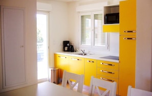 Microwave, stovetop, dishwasher, cookware/dishes/utensils