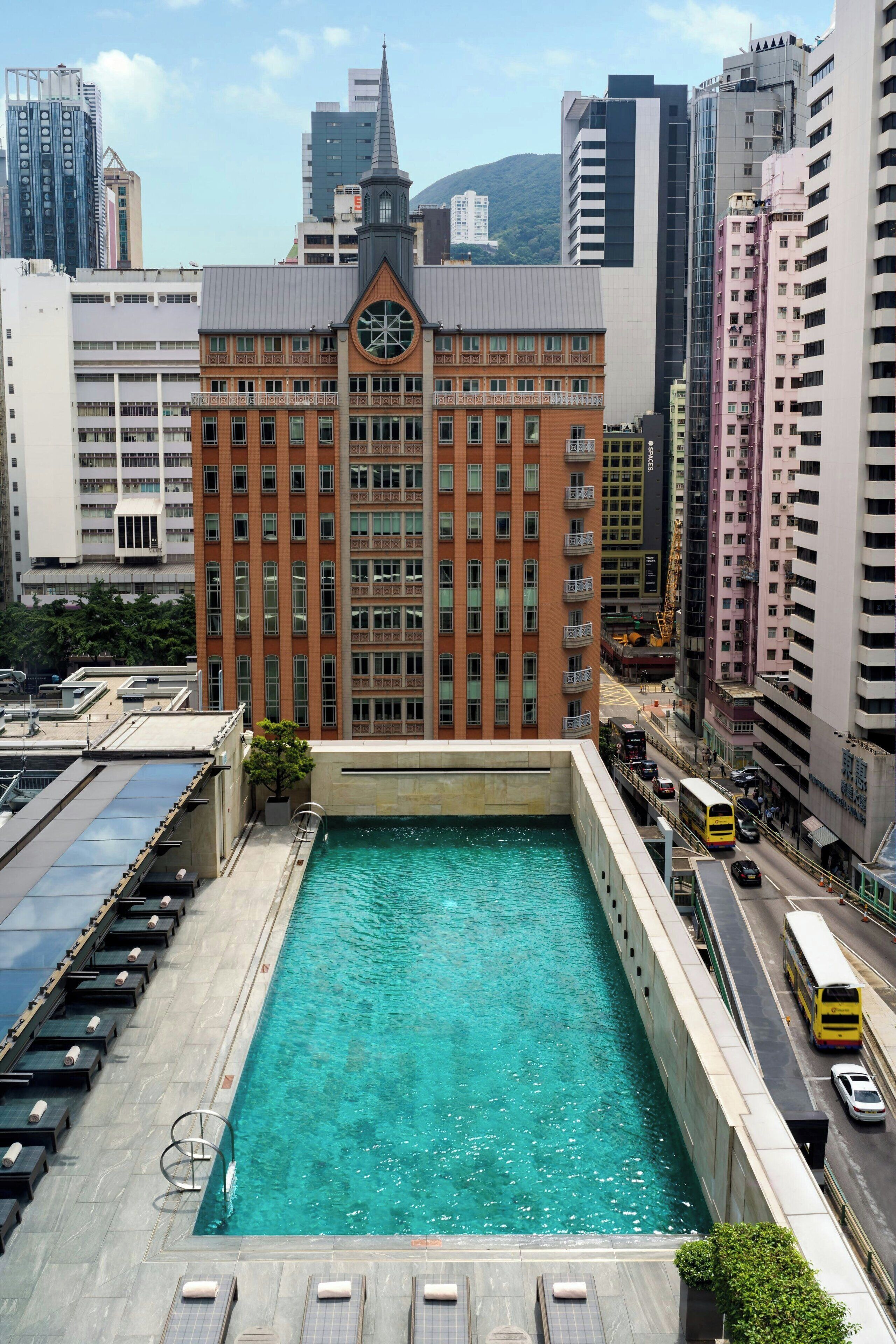 Outdoor pool, open 7:00 AM to 10:00 PM, pool loungers