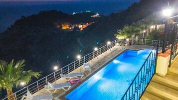 Seasonal outdoor pool, open 8:00 AM to 10:00 PM, pool umbrellas