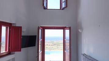 Deluxe Suite One Bedroom Sea View with Plunge Pool | Living room | 43-inch flat-screen TV with satellite channels