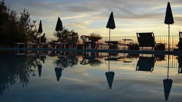 Seasonal outdoor pool, pool umbrellas, sun loungers