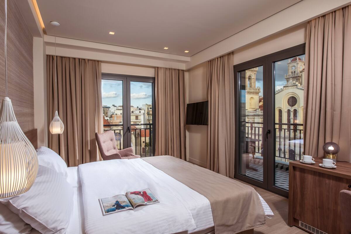 deluxe room with balcony and city view | 1 bedroom, minibar, in-room safe, individually decorated