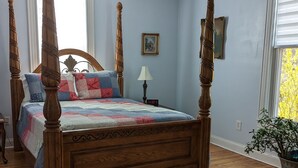 A four-poster bed with a wooden frame and a quilted bedspread. - Roomy 1896 Victorian Farmhouse Farm Stay in Lee Virginia (Dryden)