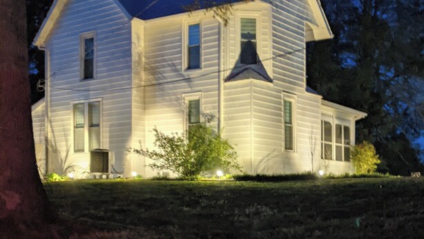 A two-story house with a gabled roof, a central chimney, and a front porch. - Roomy 1896 Victorian Farmhouse Farm Stay in Lee Virginia (Dryden)