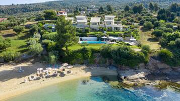 On the beach, sun-loungers, beach umbrellas, beach towels