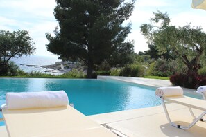 Seasonal outdoor pool, open 8:30 AM to 9:30 AM, pool umbrellas