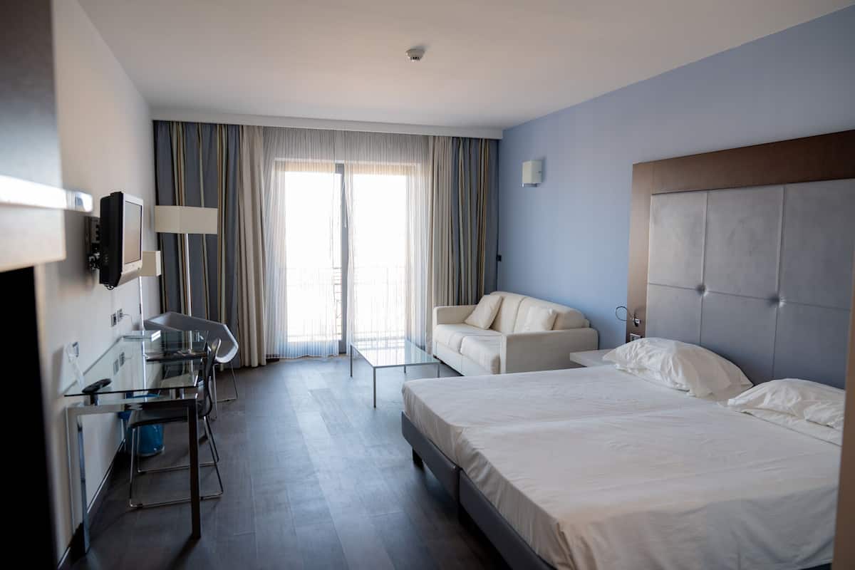 Standard Quadruple Room | 1 bedroom, hypo-allergenic bedding, down comforters, minibar