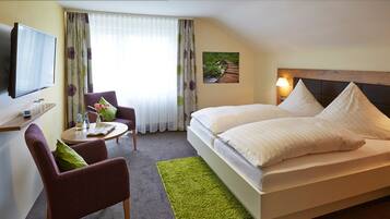 Desk, blackout curtains, bed sheets