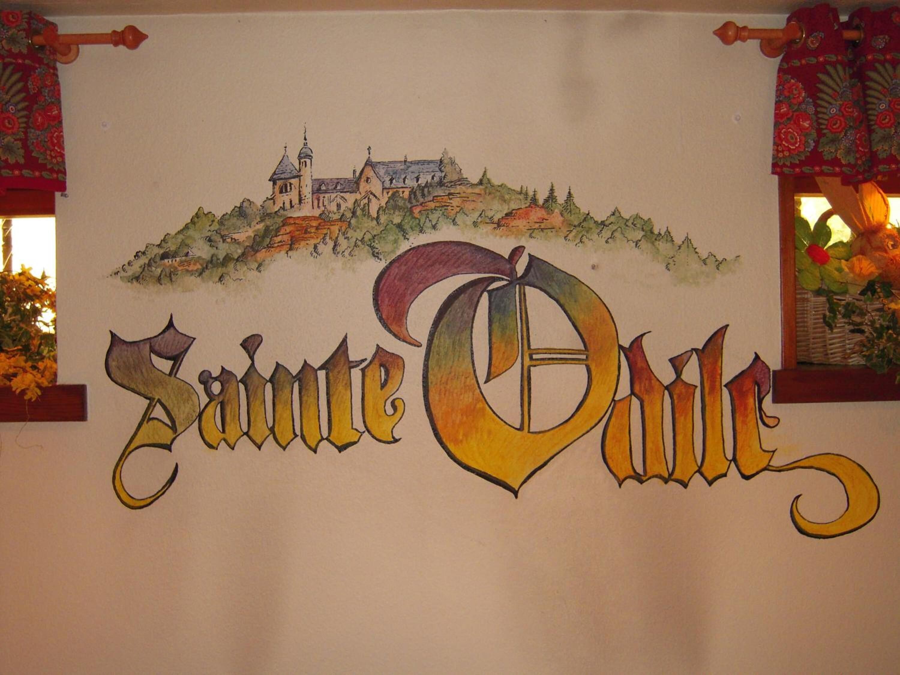Een bord met een illustratie van een kasteel en de naam 'Samte Dule' in opvallende letters.