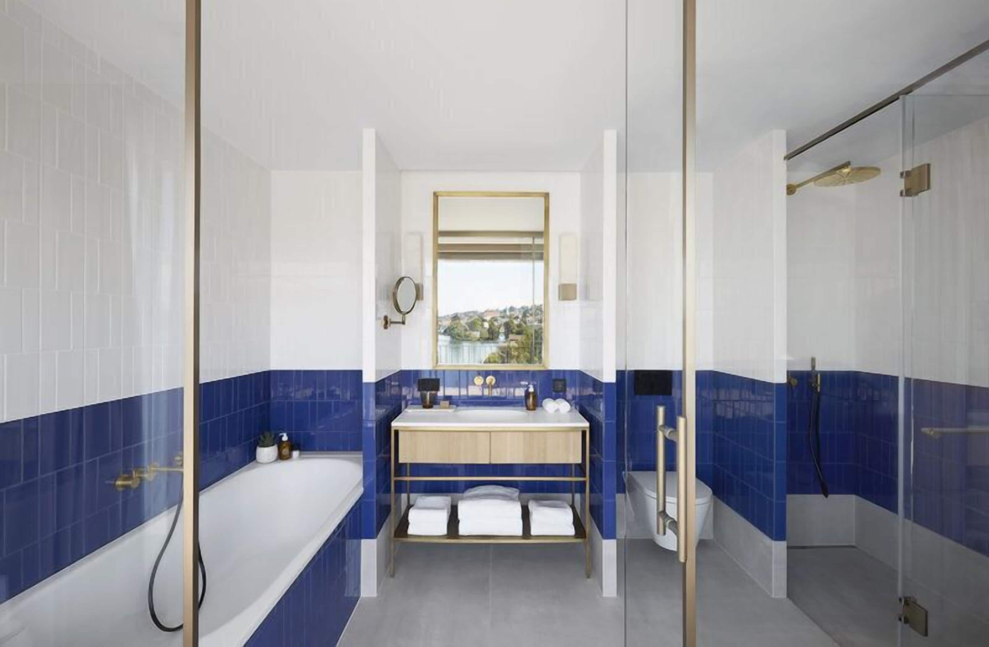 penthouse one bedroom suite | bathroom | shower, free toiletries, hair dryer, bathrobes