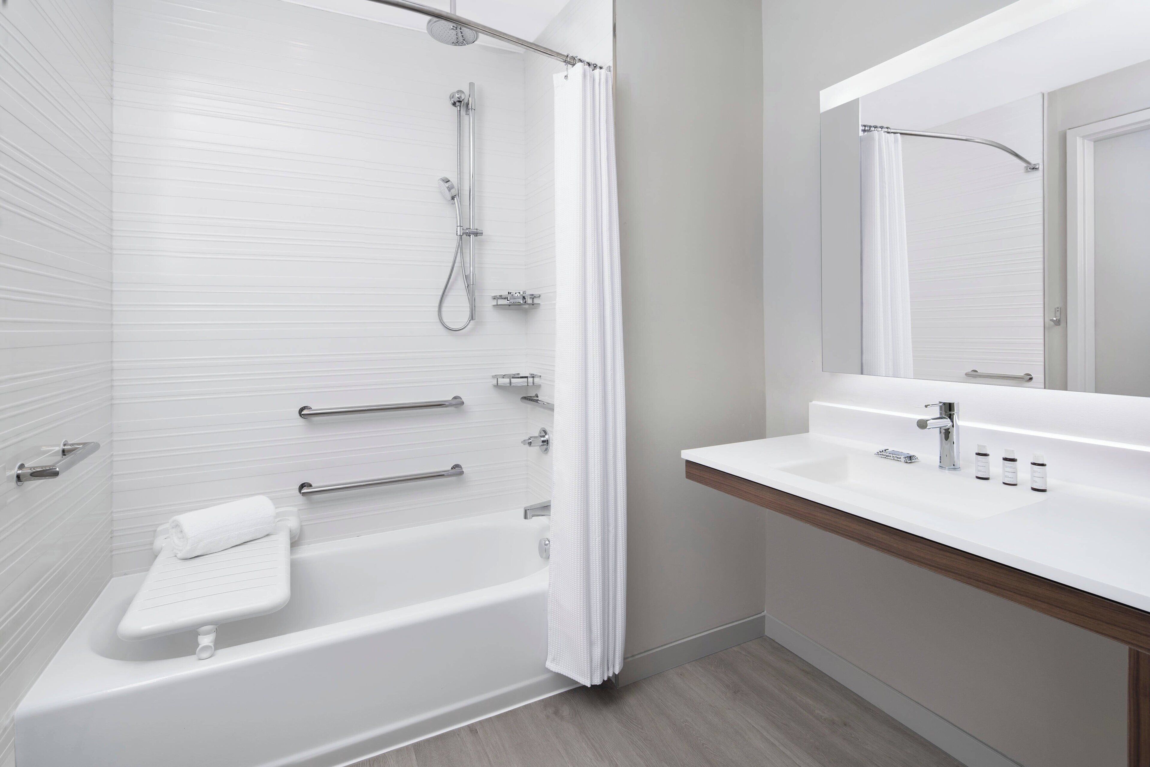 rainfall showerhead, designer toiletries, hair dryer, towels